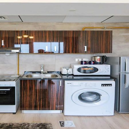 Oyo 860 Studio Apartment, Maya Tower 4, Jumeirah Village Triangle Дубай Экстерьер фото