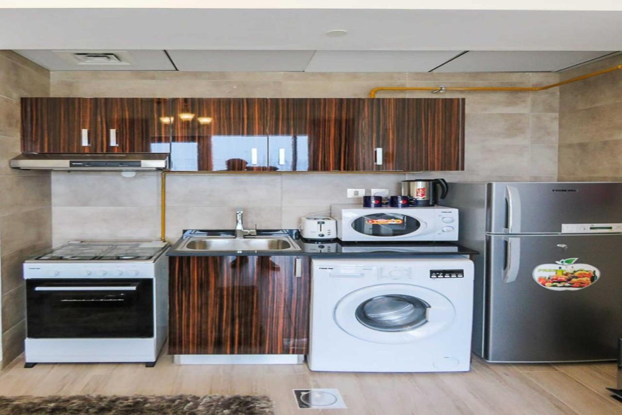 Oyo 860 Studio Apartment, Maya Tower 4, Jumeirah Village Triangle Дубай Экстерьер фото